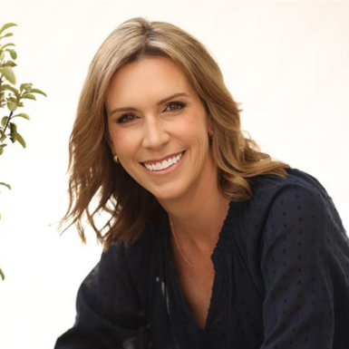 Erin Palacios smiling and wearing a black blouse